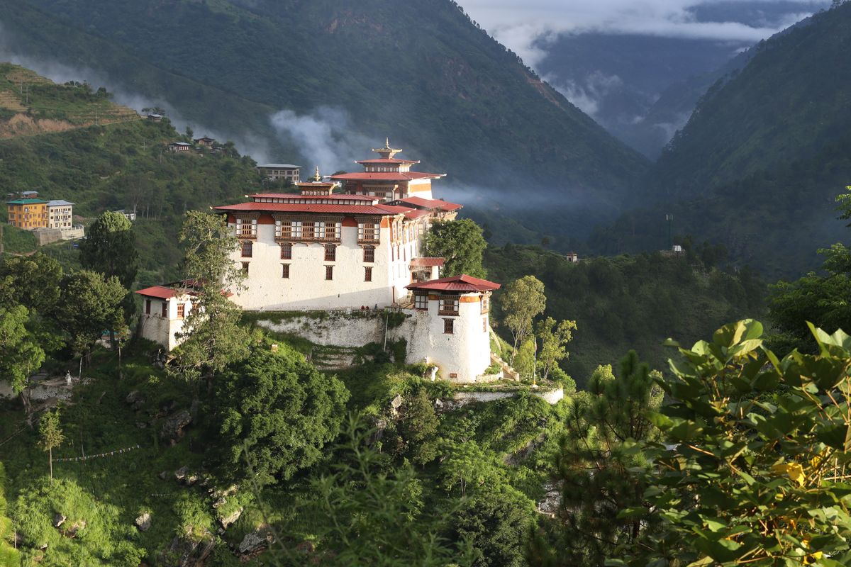 Lhuentse Dzong on a ridge above a forested valley