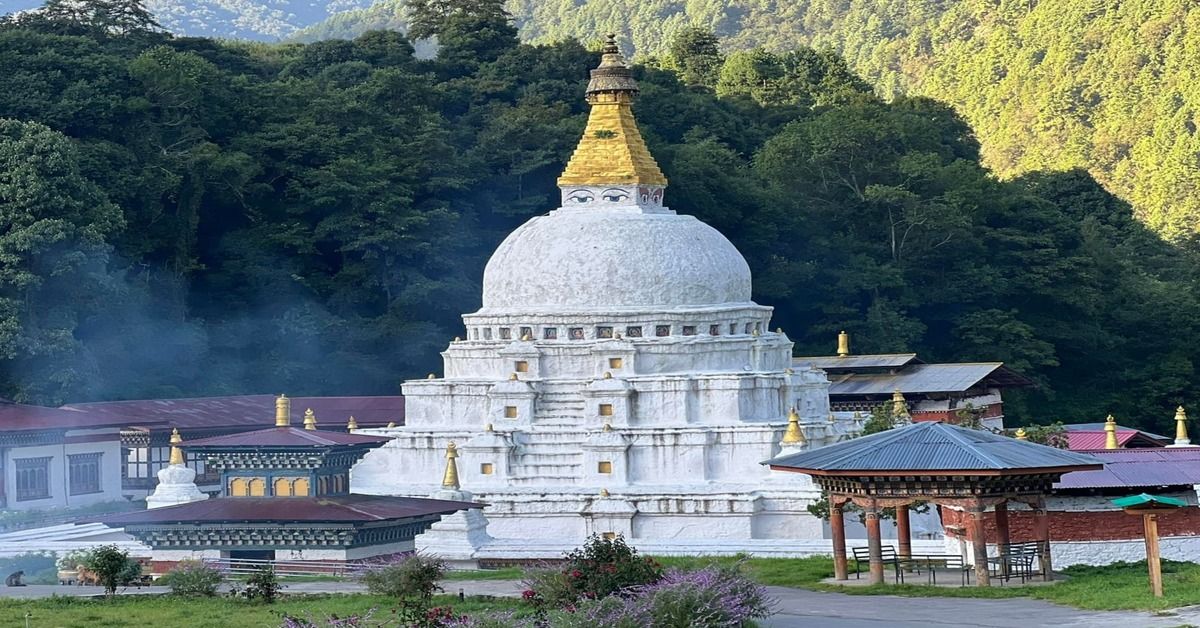 Chorten Kora stupa in Trashiyangtse surrounded by forested hills