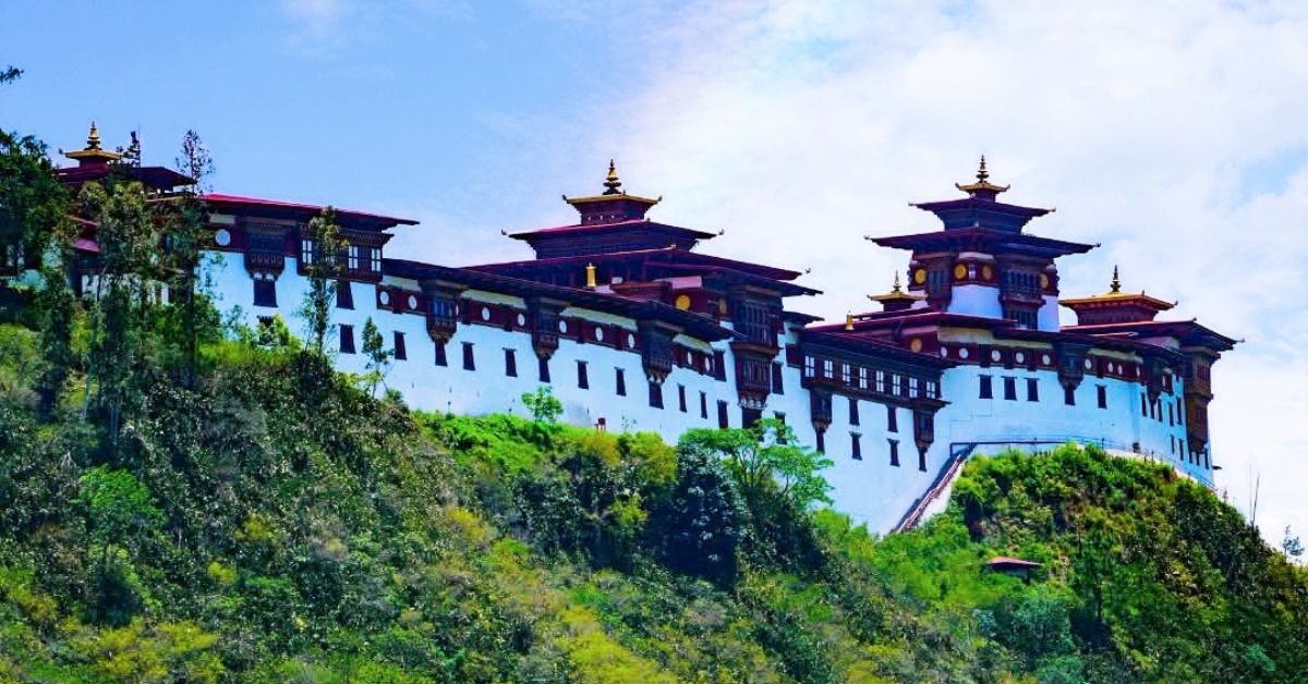 Wangdue Phodrang Dzong on a forested ridge